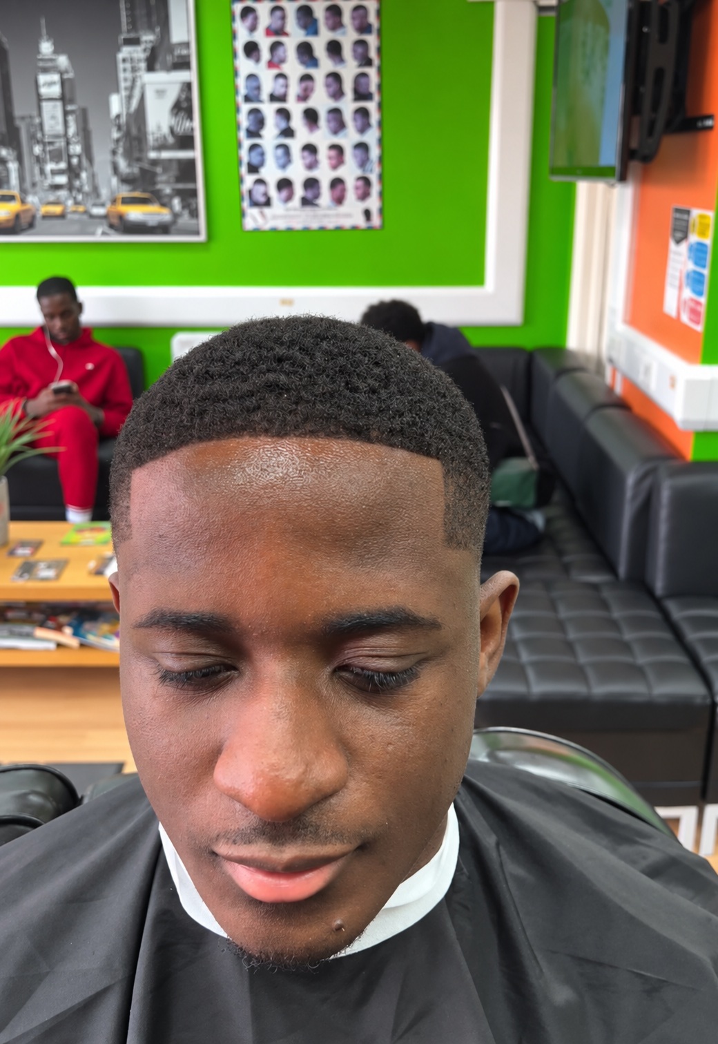 A short Afro haircut viewed from the front